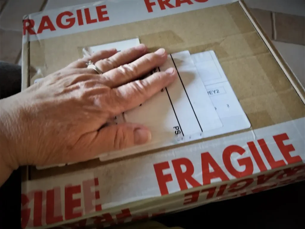 Fragile items being carefully packed for a house move in Plymouth with SDS Man and Van