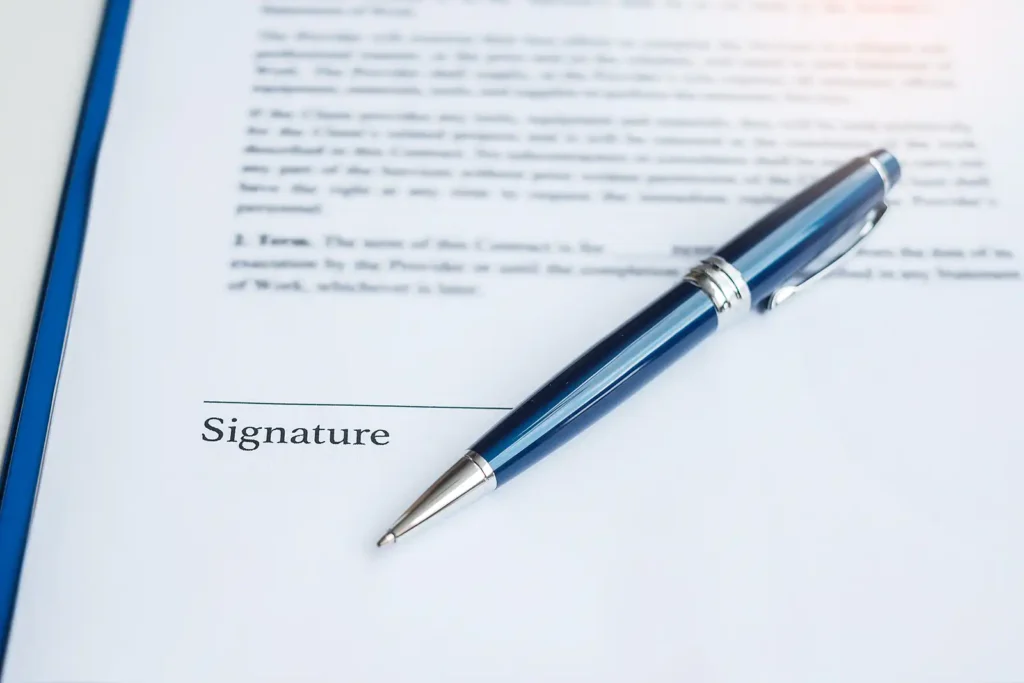 Signing property contracts on completion day in Plymouth before moving with SDS Man and Van